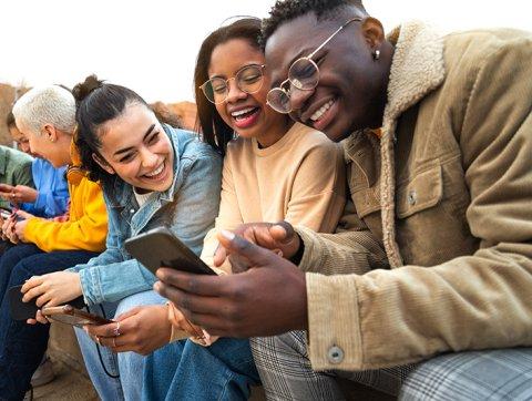 Civility students look at phone