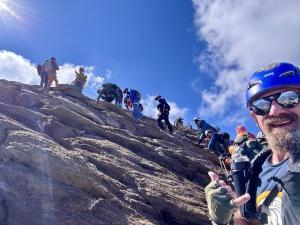 Group climbing a mountain