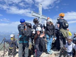 Group standing on top of a mountain